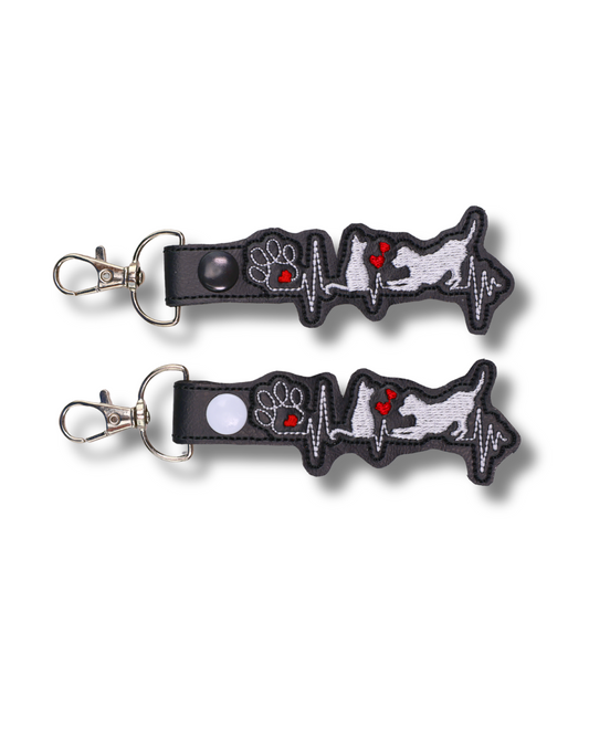 Threadify Shop cat dog heartbeat embroidered keychain with paw and heart design on black background