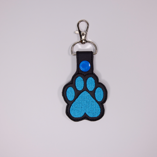 Threadify Shop embroidered paw print keychain with blue stitching and metal clasp