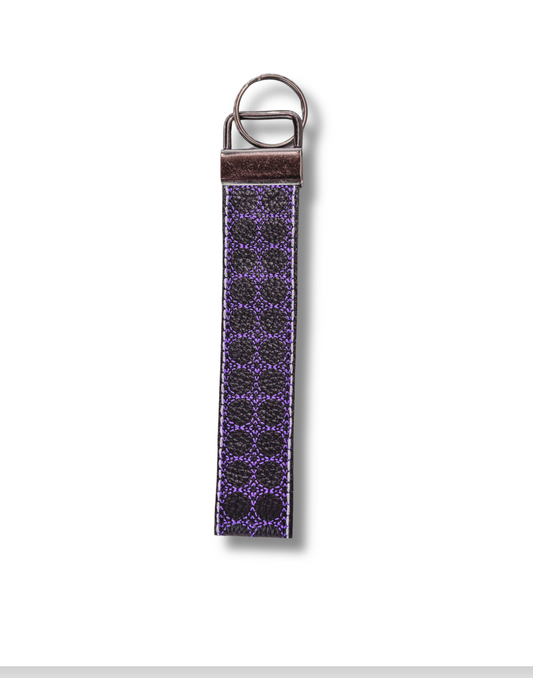 Threadify Shop handmade embroidered wristlet keychain with purple circular patterns and metal keyring