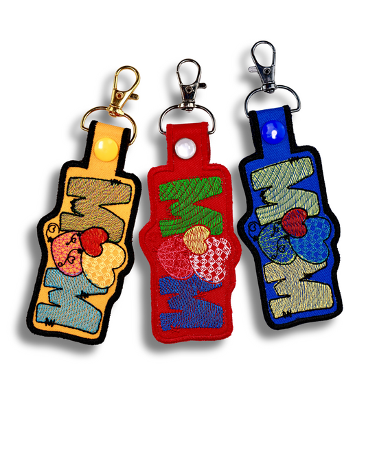 Handmade mom keychain set with colorful embroidered designs and metal clasps from Threadify Shop
