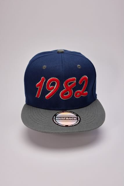 Threadify Shop 3D puffy embroidery hat in navy blue with gray brim and red 1982 stitching
