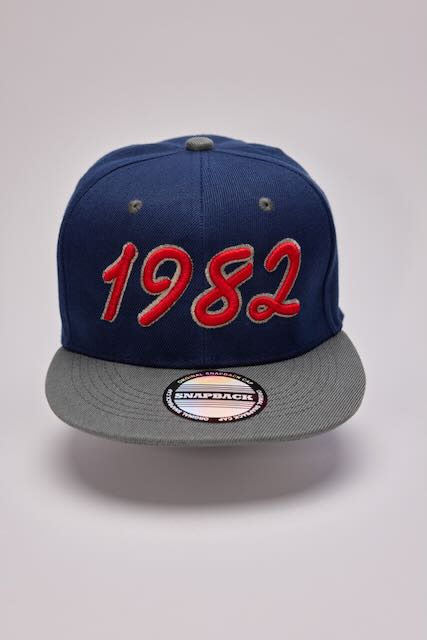 Threadify Shop blue and gray snapback hat with red 1982 design in 3D puffy embroidery hat style